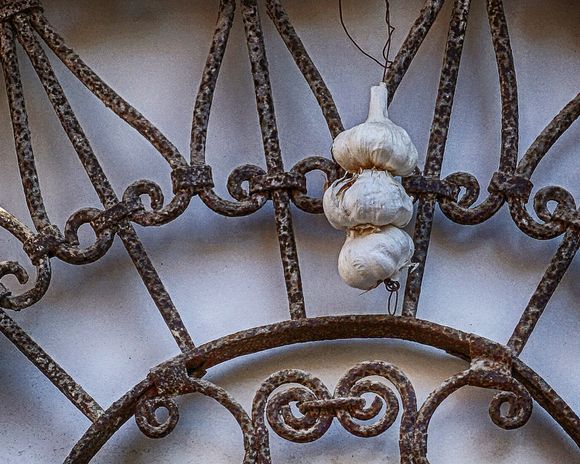 Garlic for Luck - Heads of garlic hang above an entrance in Chania's old harbor area.