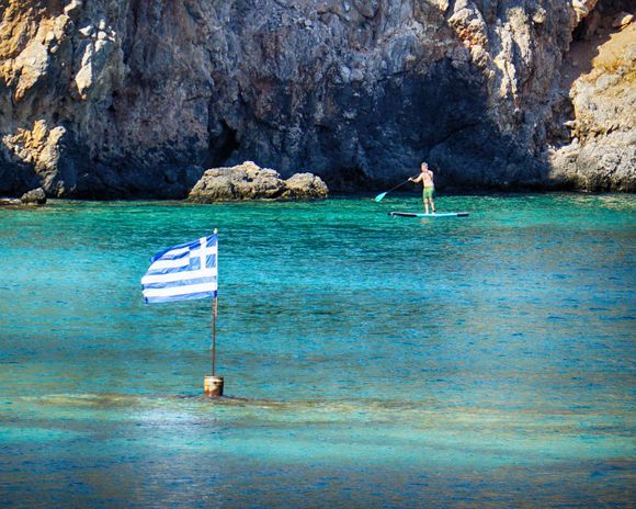 Exploring with a standup paddle board in Loutro.
