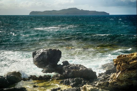 Agios Theodoros islet in the distance on a stormy day shot from Kalamaki.