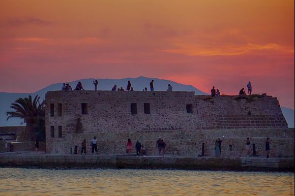 After sunset along the Chania harbor wall.