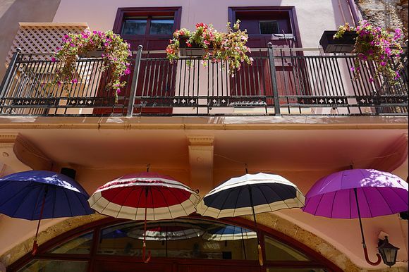 Umbrellas and balcony flowers.