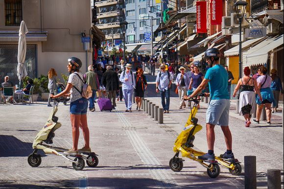 Scoot'n Along - Visitors speed along on scooters as they see the sights of Chania.