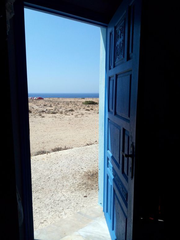Light comes in through the blue door (Agios Theodoros Church)