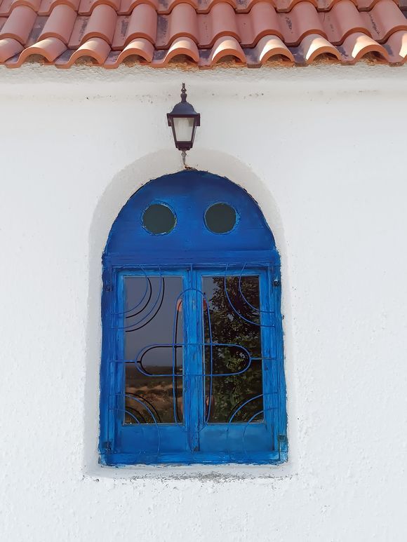 Blue window at Holy Temple of Saint Apostles & Saint Nicholas (Asopos, Lakonia)