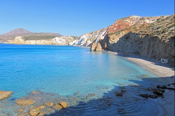 Colorful cliffs and turquoise waters at Firiplaka beach