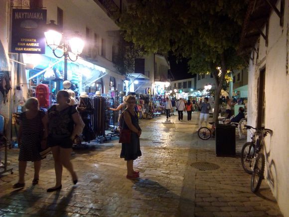 Bustling Papadiamanti street at night.