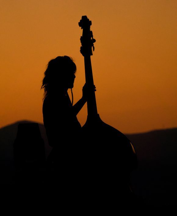 A female musician playing at the 
