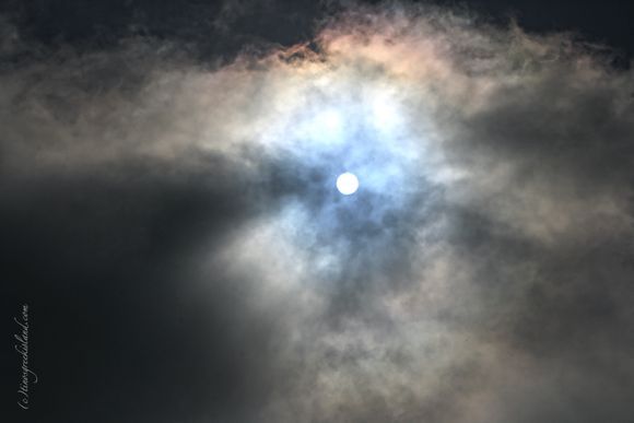 sun from behind clouds