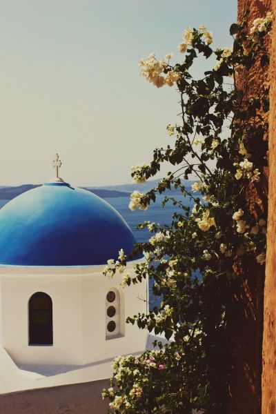 The iconic churches and flowers of Oia ~ Santorini