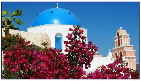 A beautiful bougainville and 2 completely different churches in Oia on Santorini.