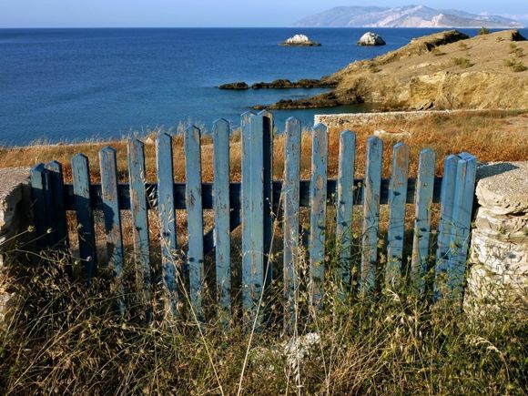 Seascape with blue wooden gate