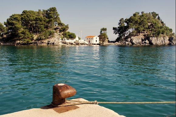 Parga islet with pinetrees and small chapel