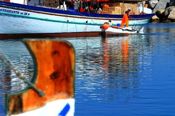 Naoussa harbour with fishermen and boats