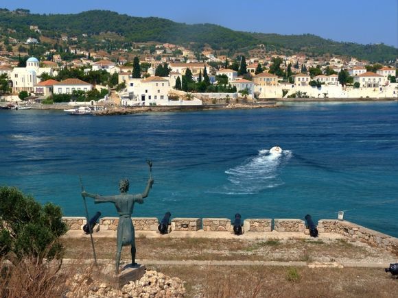 Statue of Cosmas Barbatsis and Old Port view