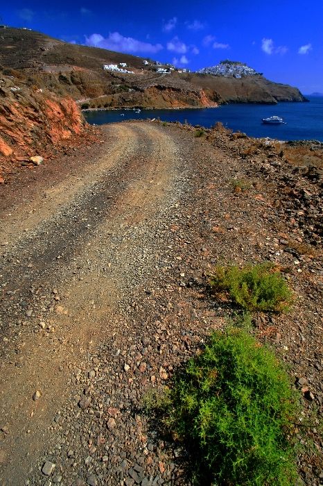 Coastal unasphalted road with view of Chora