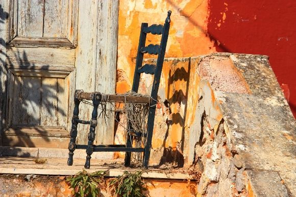 Decayed chair and house, Kaminia