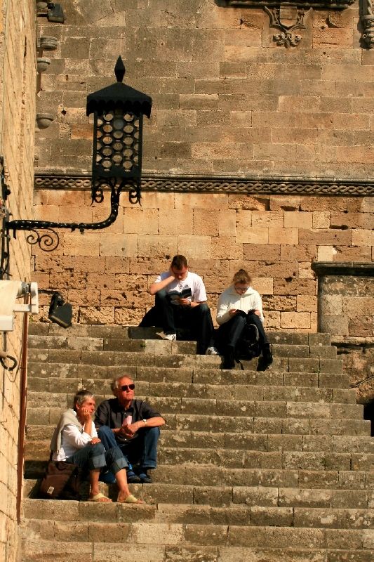 People sitting on stairs, Old Town