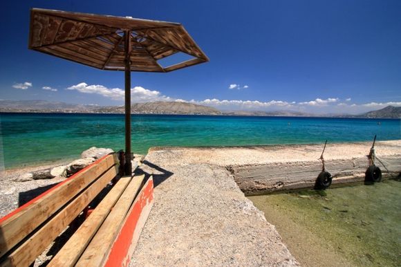 Shore with bench and umbrella, Eandio, Salamina island