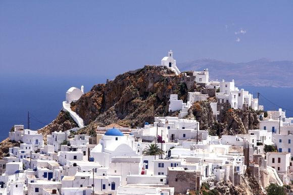 Chora view with cycladic churches on top of the hill