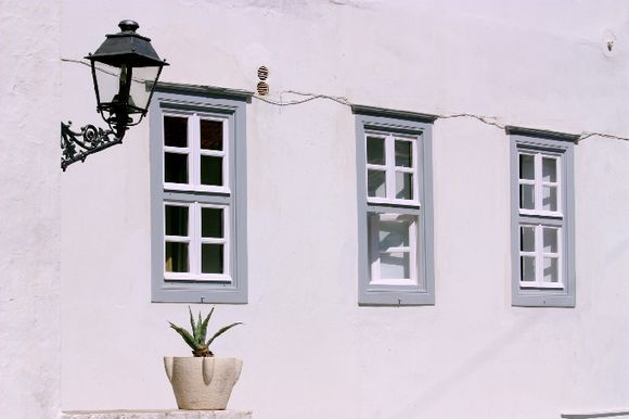 White facade with lamp, Hydra town