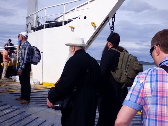 Monks and pilgrims boarding the ferry to Mount Athos
