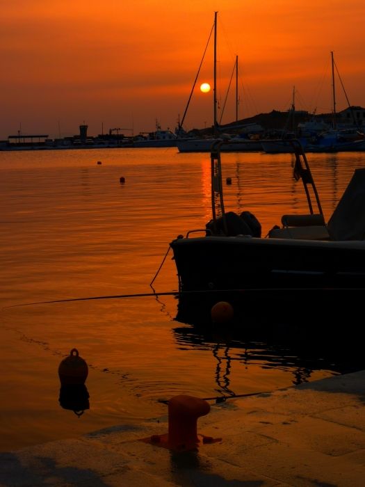Sundown on Tinos town harbour