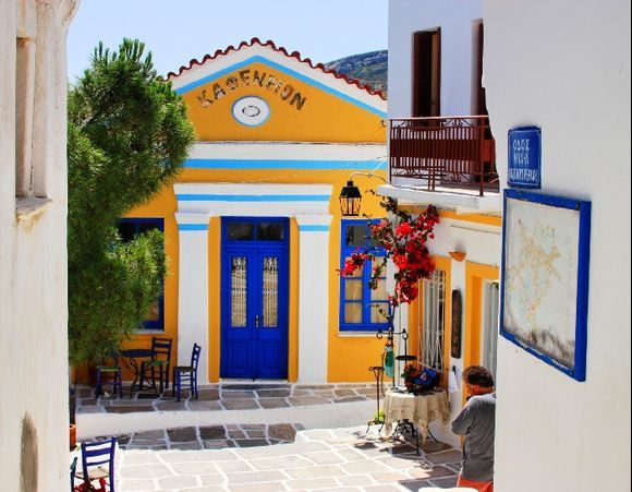 Square with colorful kafeneion. Lefkes