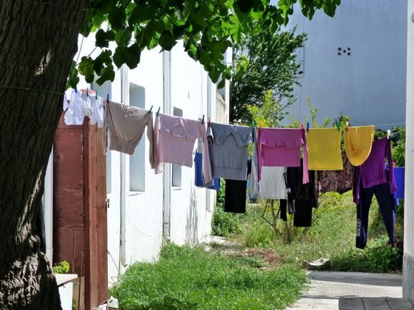 Colorful laundry and green surroundings in Parikia