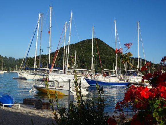 Nidri Bay with colorful boats and flowers