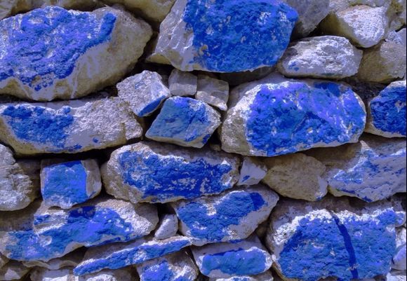 Blue-painted dry stonewall