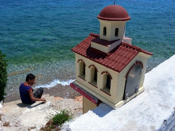Sea, boy and miniature shrine