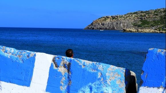 Scenery with Greek flag and man