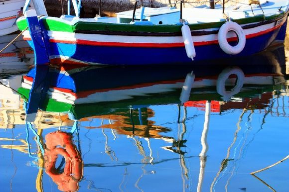 Fishing boat and reflections, Parikia