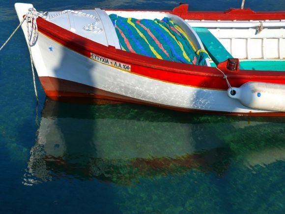 Colorful boat with reflection