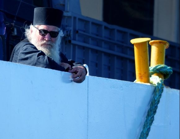 Monk on board the ferry to Mount Athos waiting for departure