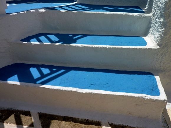 Blue steps with sun light and shadows
