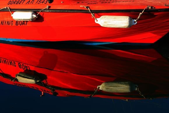 Mirror image with red fishing boat, Naoussa