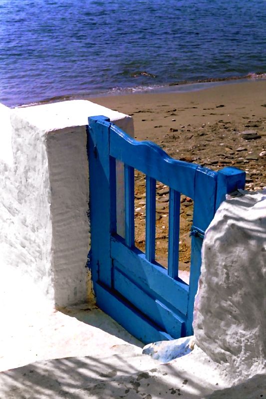 Small blue wooden gate. Isternia beach. Tinos island