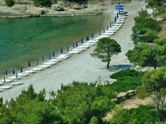 Green water and pine trees on Xilokeriza beach
