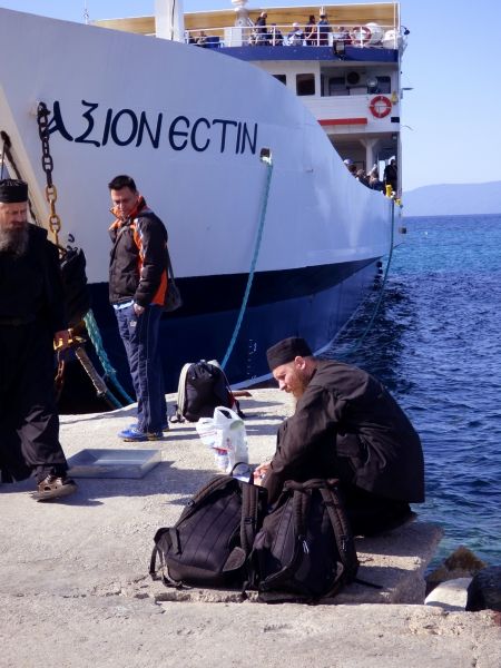 Monks getting ready for boarding the ferry to Mount Athos
