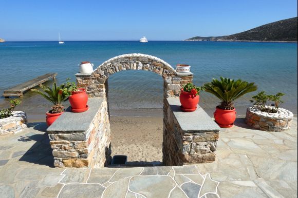 Gate and red pots on the beach, Platys Gialos