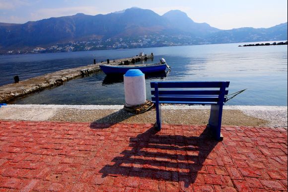 Waterfron twith bench. Telendos island