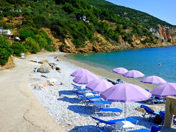 Glifoneri beach with colorful umbrellas, Skopelos island, Sporades