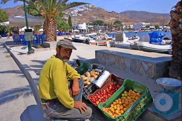 Waterfront with fruit and vegetables stall vendor, Serifos island, Cyclades