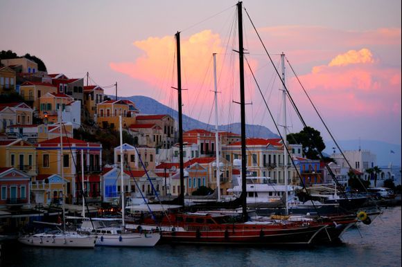 Harbour view with boats at sunset. Gialos, Simi island, Dodecanese