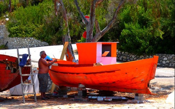 Orange boat painting in Meganissi