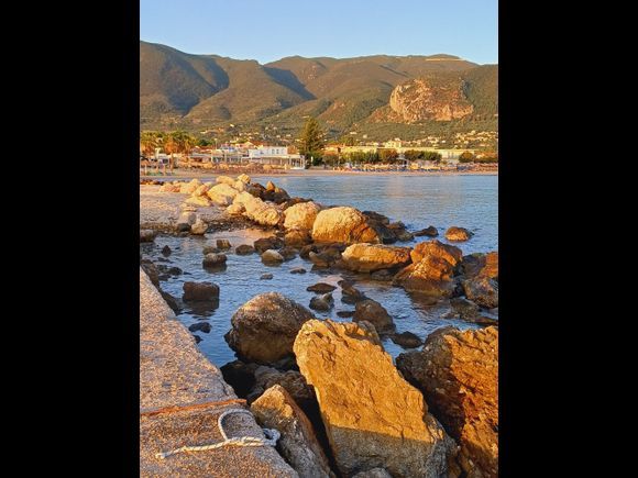 Sunrise on jetty and stones