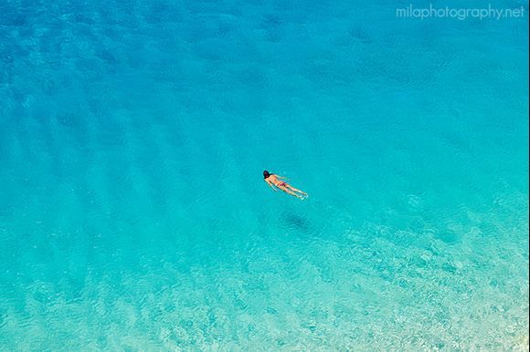 Woman swimming at Porto Katsiki beach