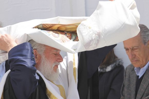 Priest with hte \'dress of Jesus\' in procession around the church...