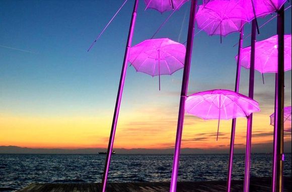 Pink umbrellas in port of Salonica